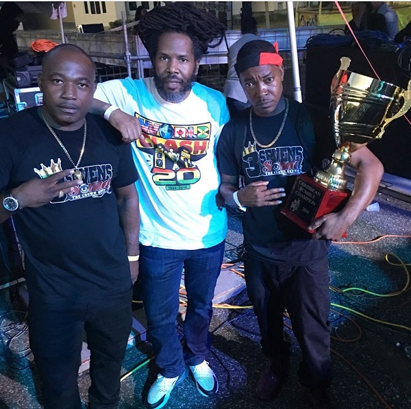 Caribbean Rumble Champions 3 Sevens (MC Panther and Selector Federal) pose with promoter Garfield "Chin" Bourne following victory