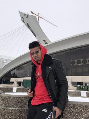 Genre Fluid, Billboard charting K'Coneil posing in front of Montreal's Olympic stadium