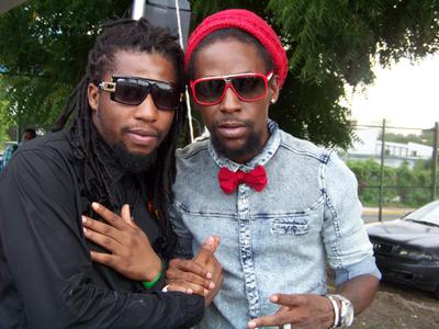 Don Zee and Jah Cure pose for a pic after performing
