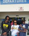 Gully Bop strikes a pose with Shauna Chin (fiancée`/ manager) and Pantason prior to departing Sangster International Airport in Montego Bay. 