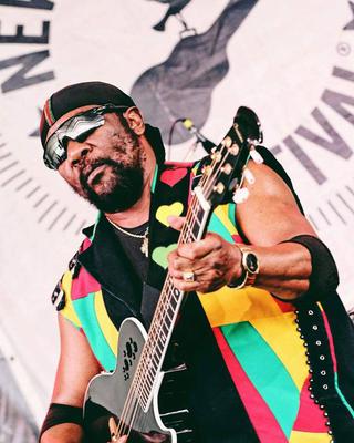 Toots Hibbert rocking the One Love Guitar Strap
